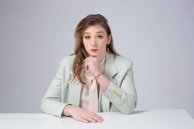 Quinnlan Varcoe — mint blazer, table pose